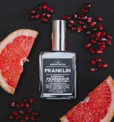 Franklin organic cologne with grapefruit slices and pomegranate seeds