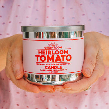 Hands holding the Heirloom Tomato 100% soy wax candle