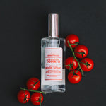 Heirloom Tomato room spray with cherry tomatoes on the vine on a black background