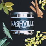 Nashville candle jar with cardamom pods and sandalwood sticks